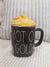 Rae Dunn " POT O' GOLD" Black Mug and Gold Coins Mug Topper Collection